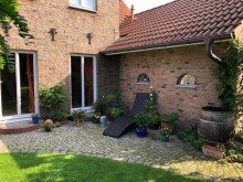 Ausgang in den Garten Exklusives Landhaus  ROSE GARDEN  Ambiente & Flair direkt vor Sylt!